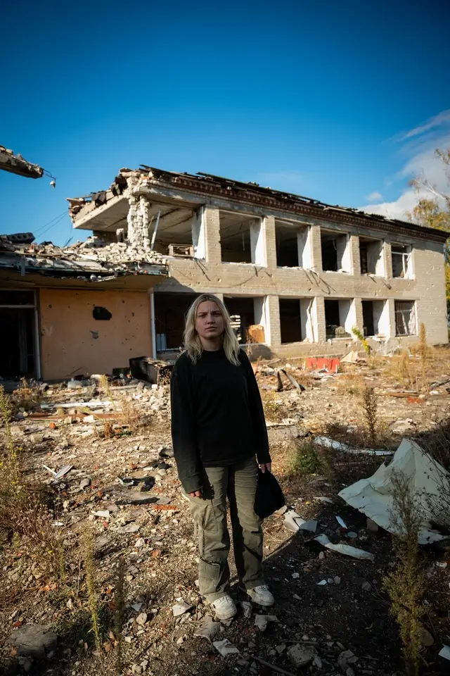 Kelsie Kimberlin and destroyed building